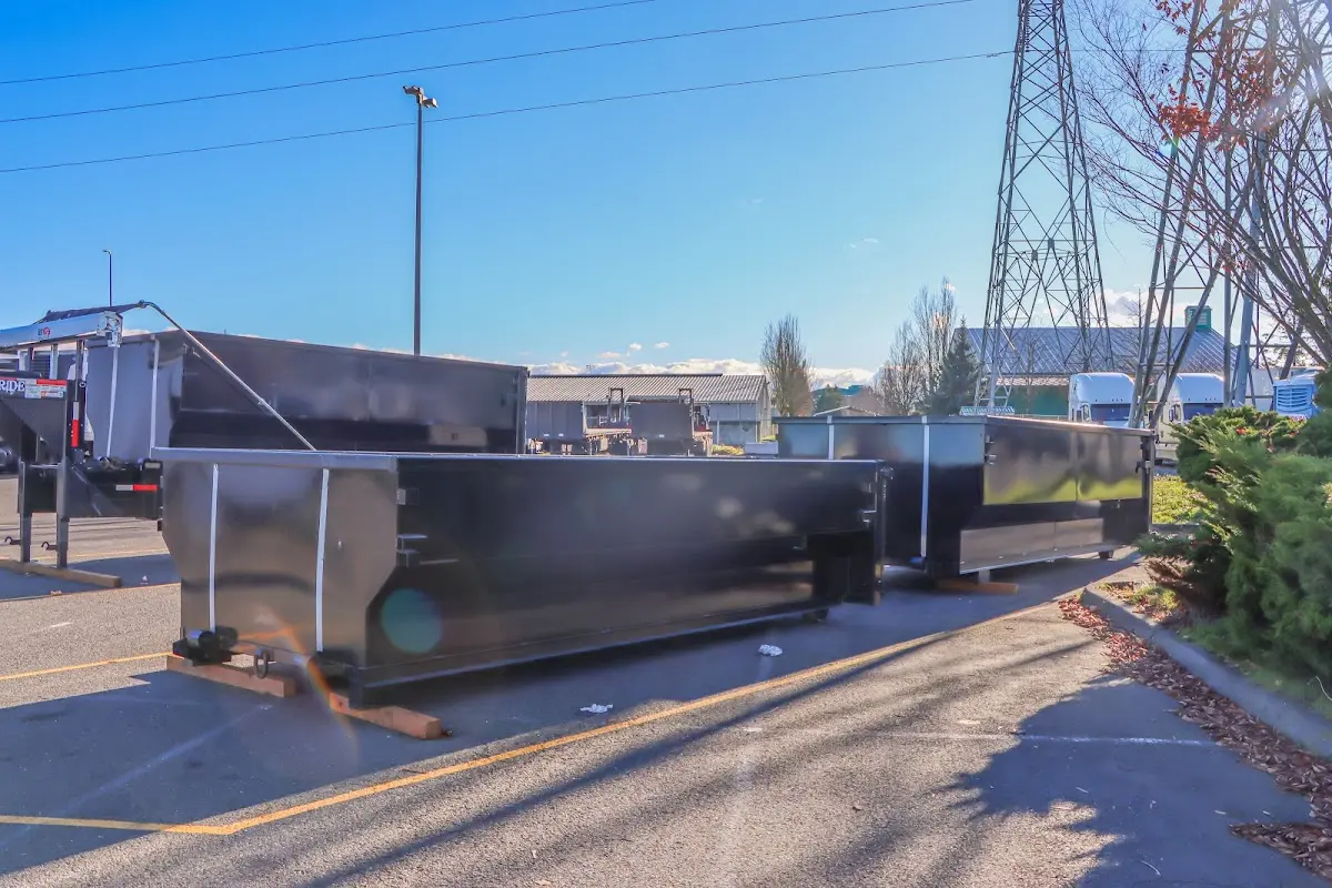 Roll-off dumpster ready for waste disposal at job site for 12 Yard Dumpster Rental in Millcreek